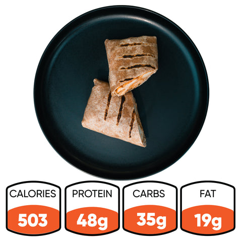 A black plate holds two Cheesy Garlic Chicken Wraps. Nutrition facts below show 503 calories, 48g protein, 35g carbs, and 19g fat—making this Cheesy Garlic Chicken Wrap ideal for high-protein meal prep.