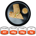 Wrap with a side of sauce on a black plate, with nutritional information displayed below.