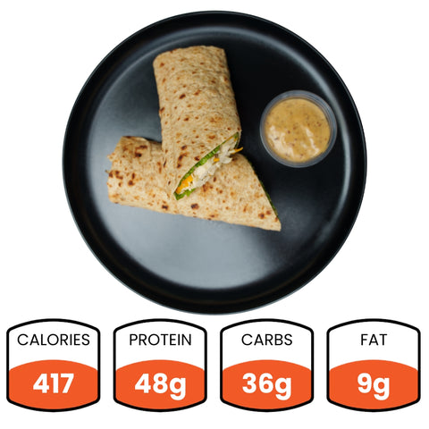 Wrap with a side of sauce on a black plate, with nutritional information displayed below.