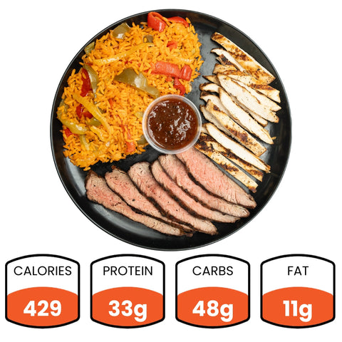 Grillin' Gains: A black plate with grilled chicken, steak slices, yellow rice with veggies, and sauce—perfect post-workout meal prep. Nutrition: 429 calories, 33g protein, 48g carbs, 11g fat.
