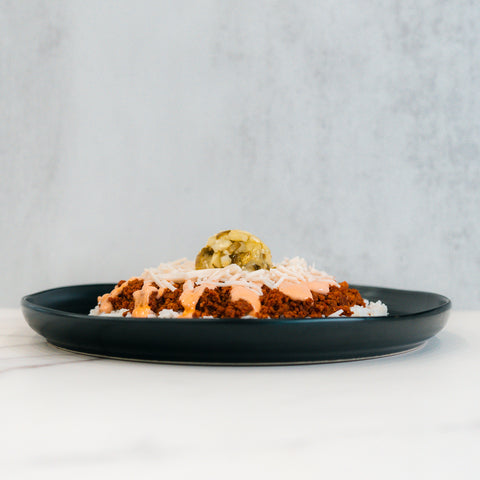 Tazón de hamburguesa con queso vegano.